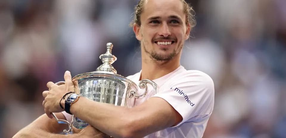 Player celebrating with trophy after tournament victory