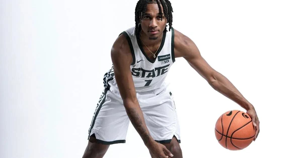Player dribbling basketball in team uniform