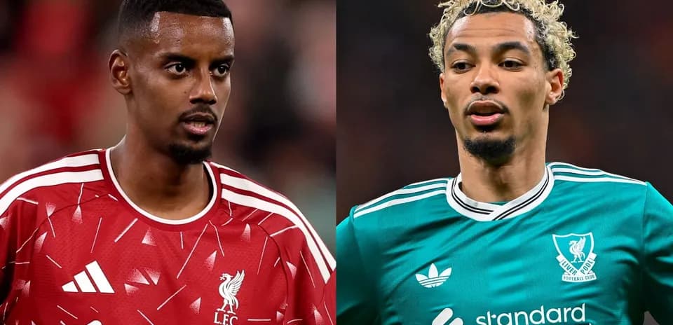 Two Liverpool players in match jerseys