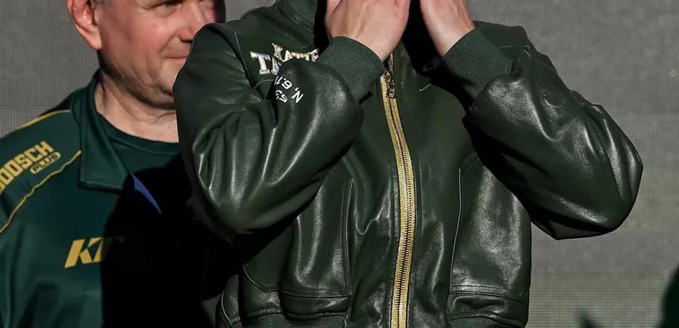 Female boxer blowing kisses during event presentation