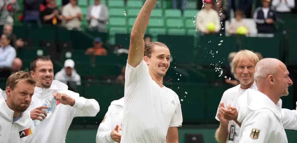 Player celebrating with teammates after match victory