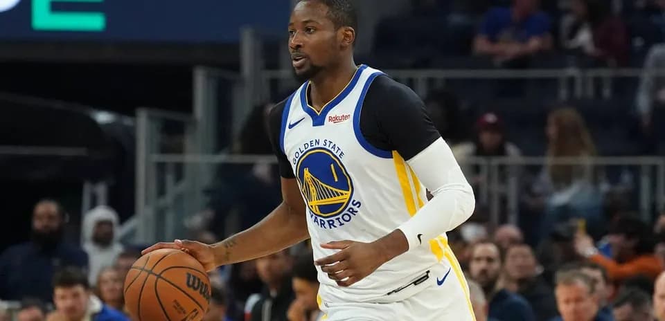 Player dribbling basketball during game action