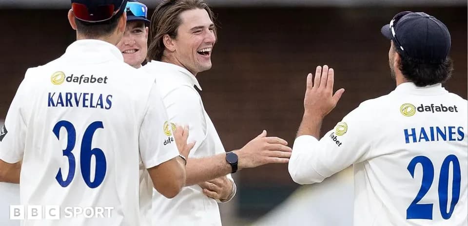 Cricketers celebrating a wicket on the field