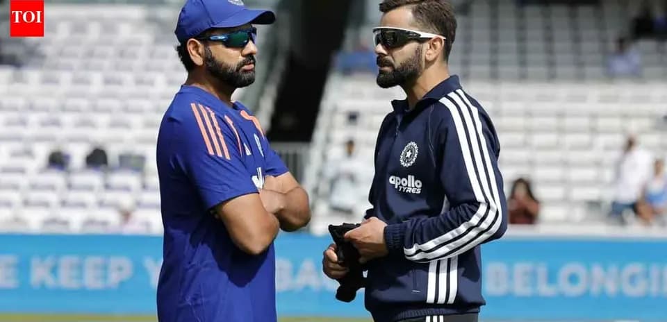 Rohit Sharma and Virat Kohli talking on the field