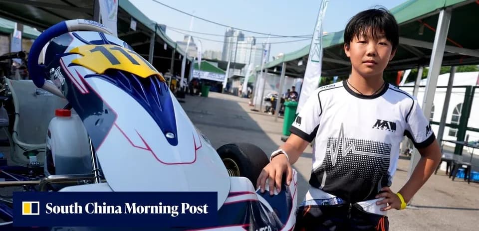 Young kart driver posing next to racing kart