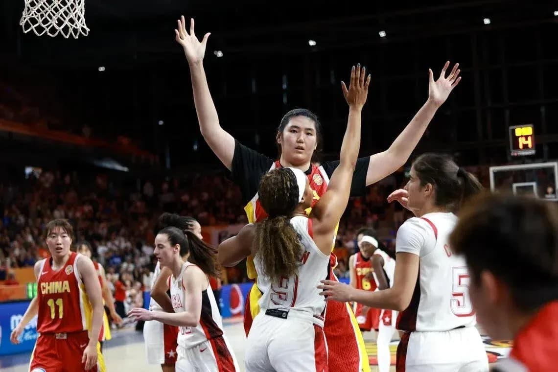 Players contesting during a basketball match