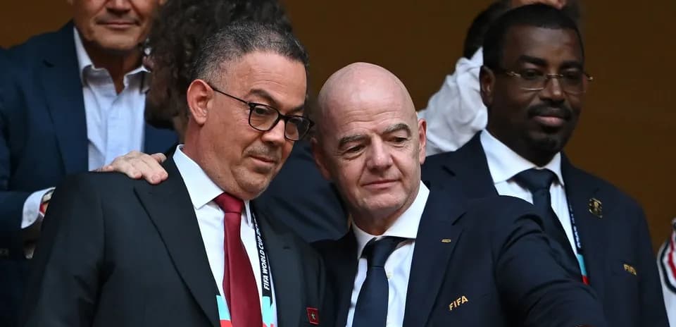 FIFA officials discussing at a World Cup event