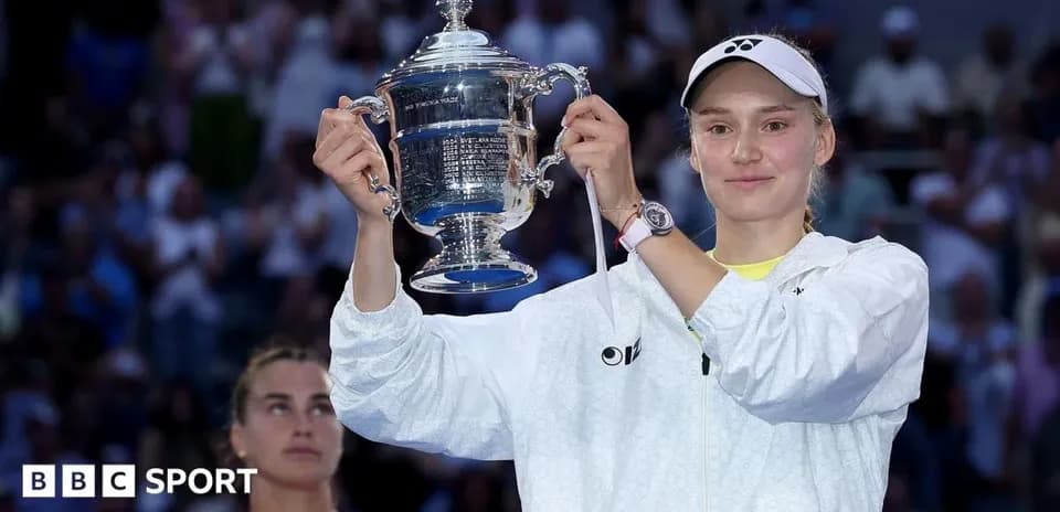 Player holding trophy after winning tennis match