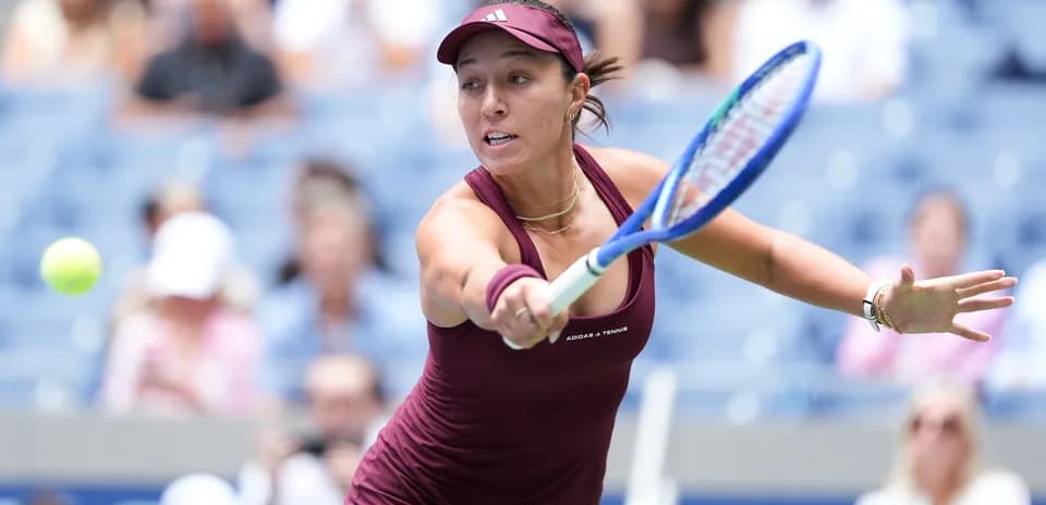 Player hitting a tennis ball during a match