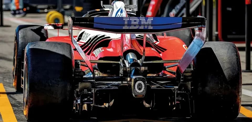 Red Formula 1 car in the pit lane