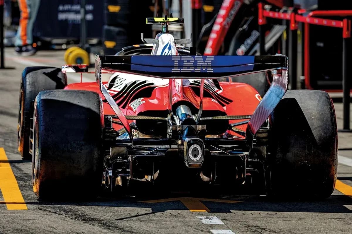 Red Formula 1 car in the pit lane