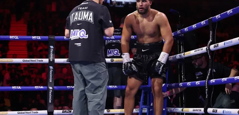 Boxer resting on stool during match corner advice