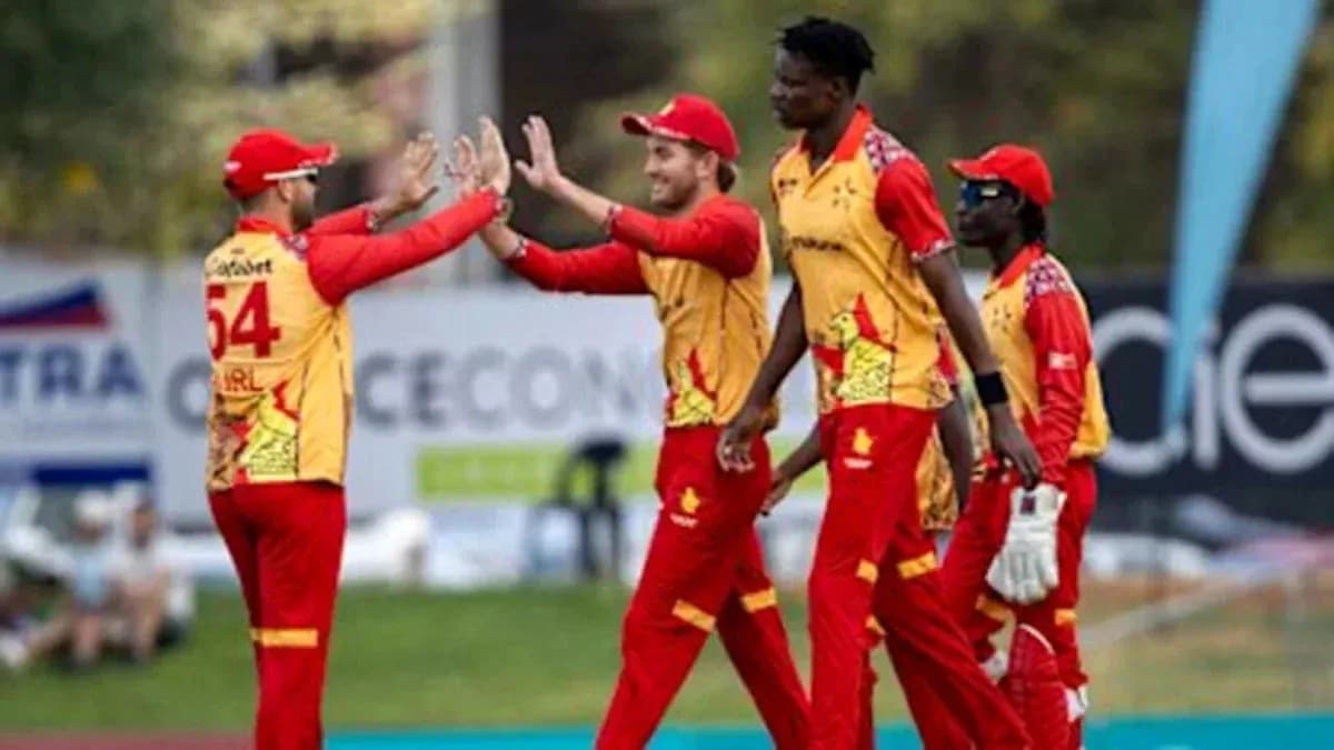 Cricket team celebrating a wicket on field