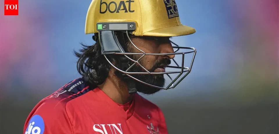 Cricketer wearing a helmet during a match