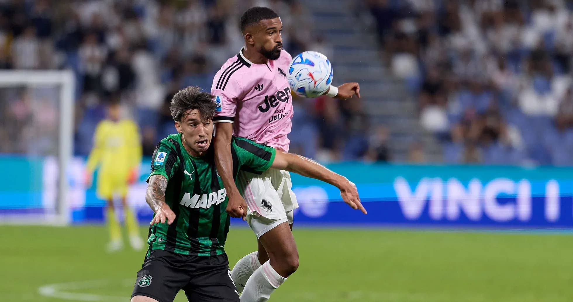 Two players battling for the ball during match