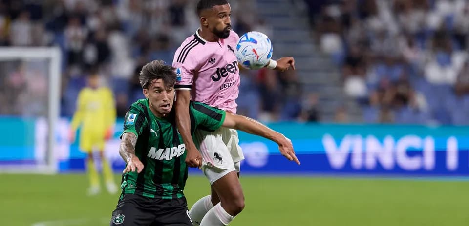 Two players battling for the ball during match