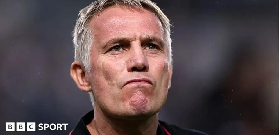 Manager looking thoughtful during a match