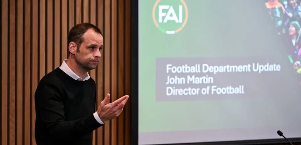 Director presenting at football department update meeting