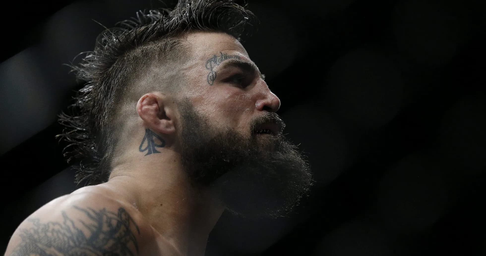 Close-up of fighter with tattoos in profile