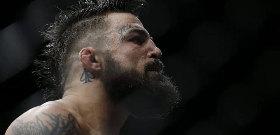 Close-up of fighter with tattoos in profile