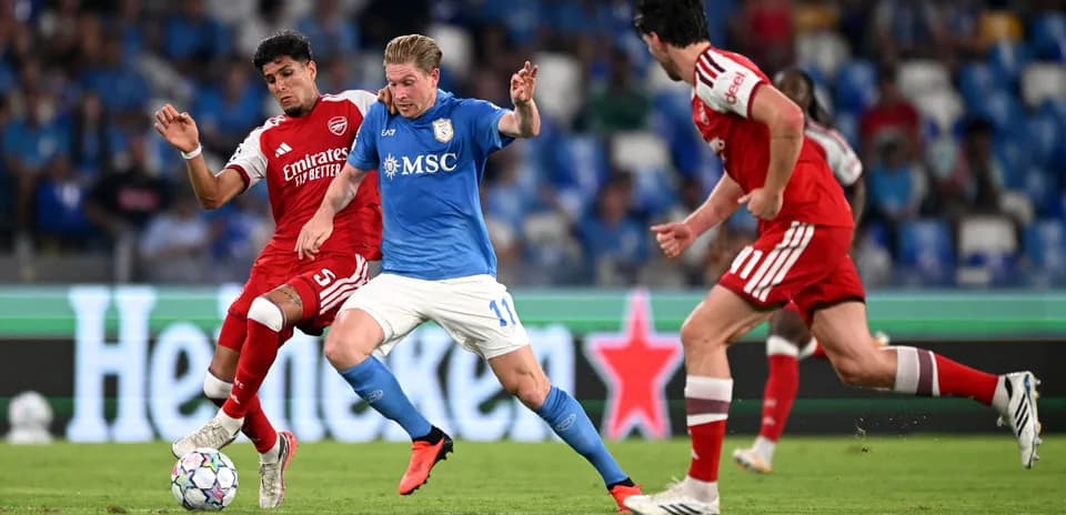 Players contesting possession during a football match