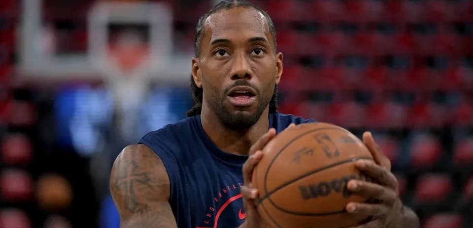 Player preparing to shoot basketball during warm-up
