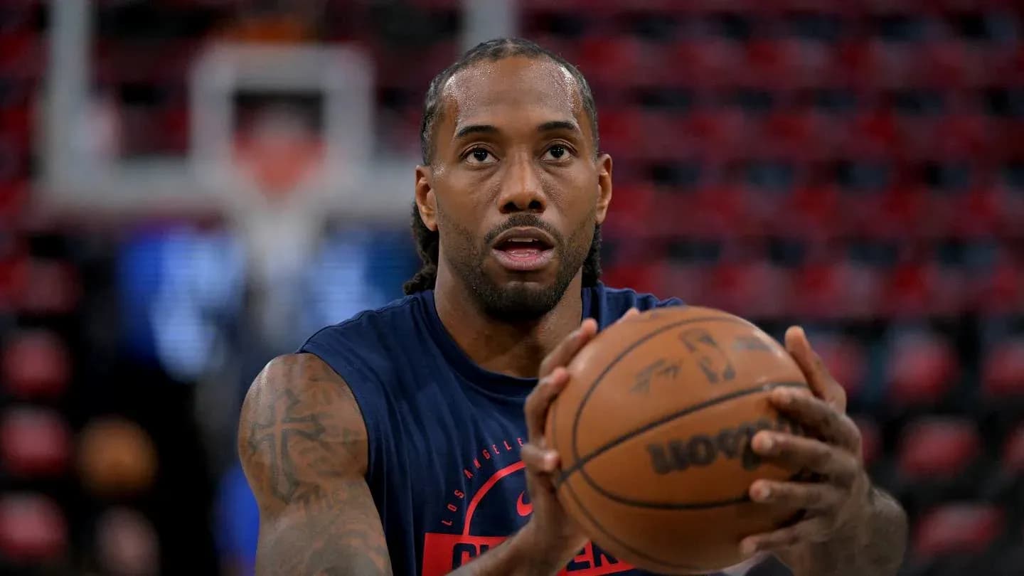 Player preparing to shoot basketball during warm-up