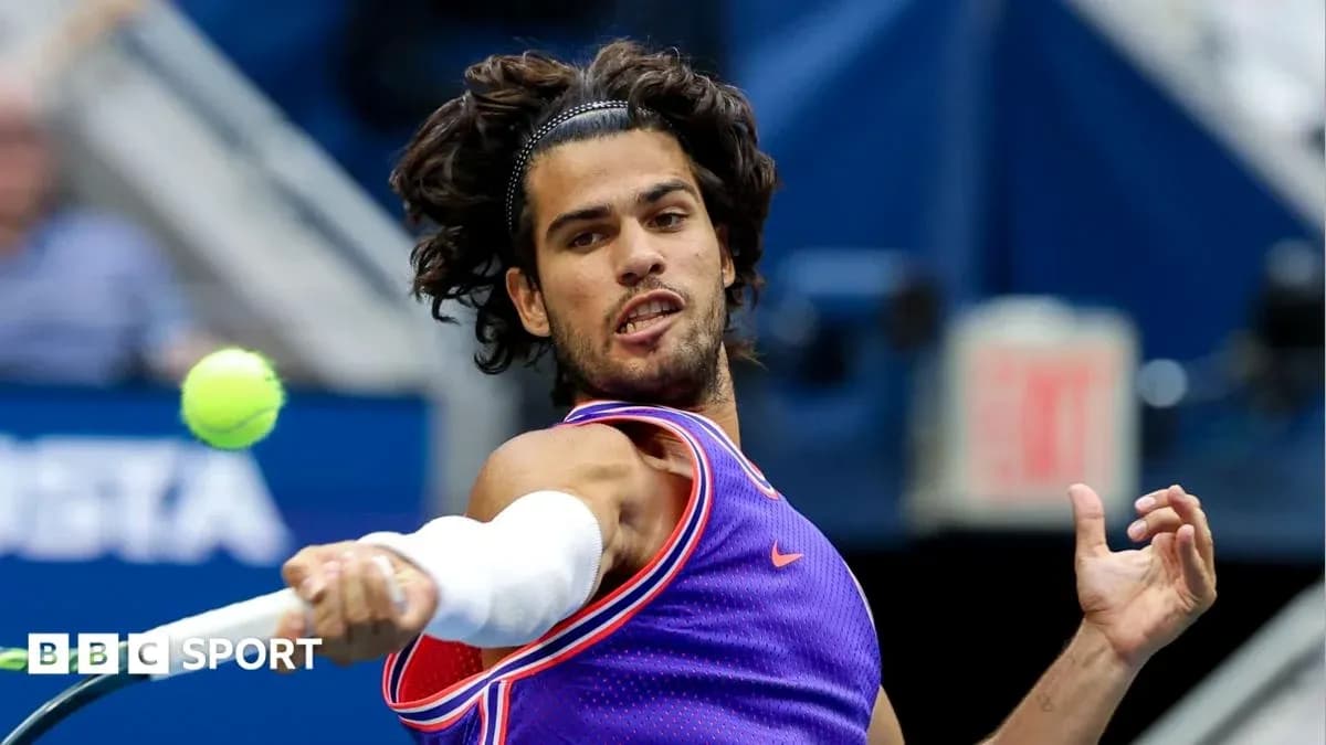 Player hitting a tennis ball during a match