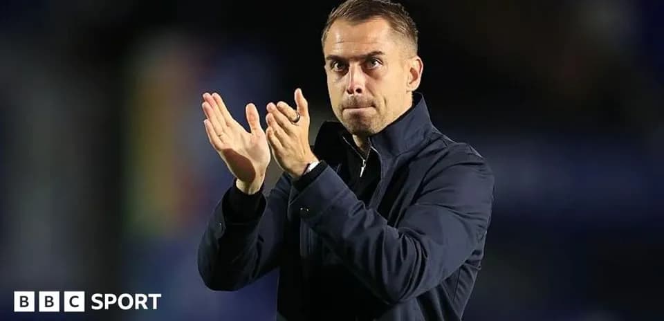 Manager clapping in front of the crowd