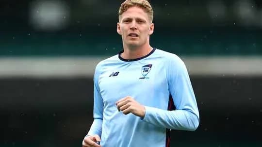 Player jogging during training session in light blue kit
