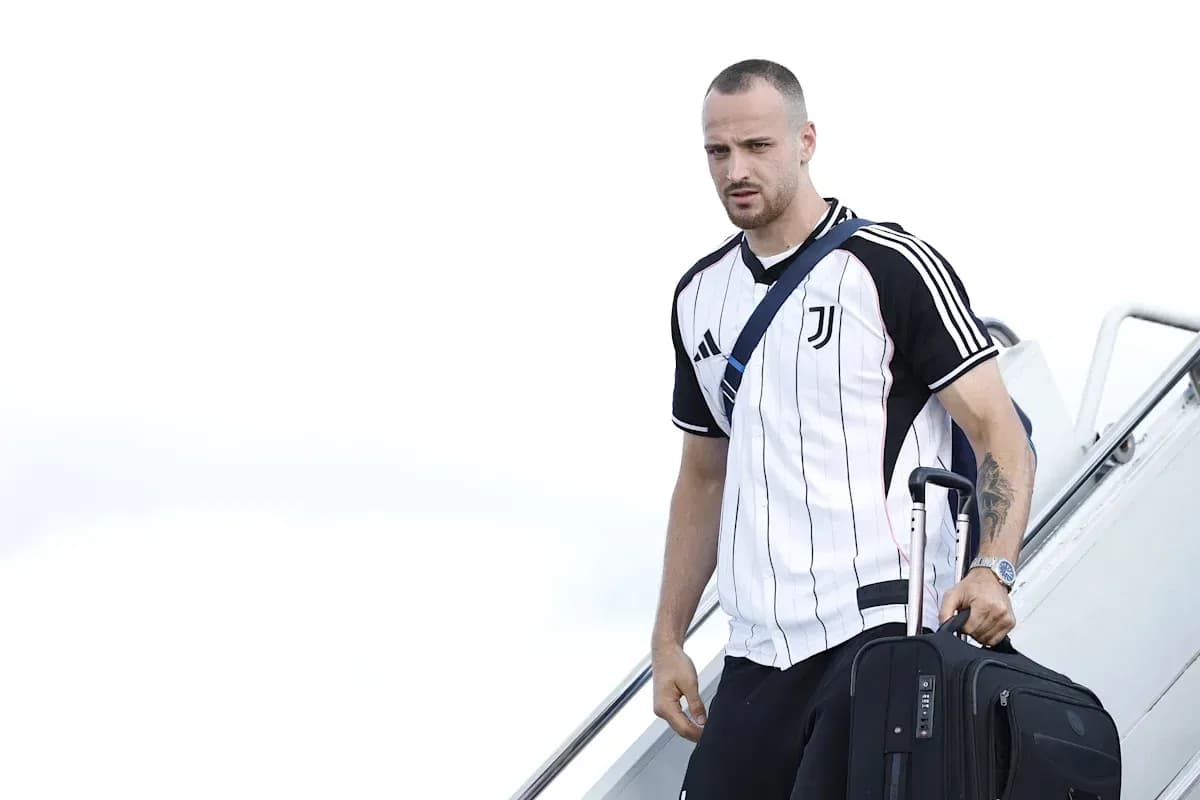 Player arriving with luggage at airport steps