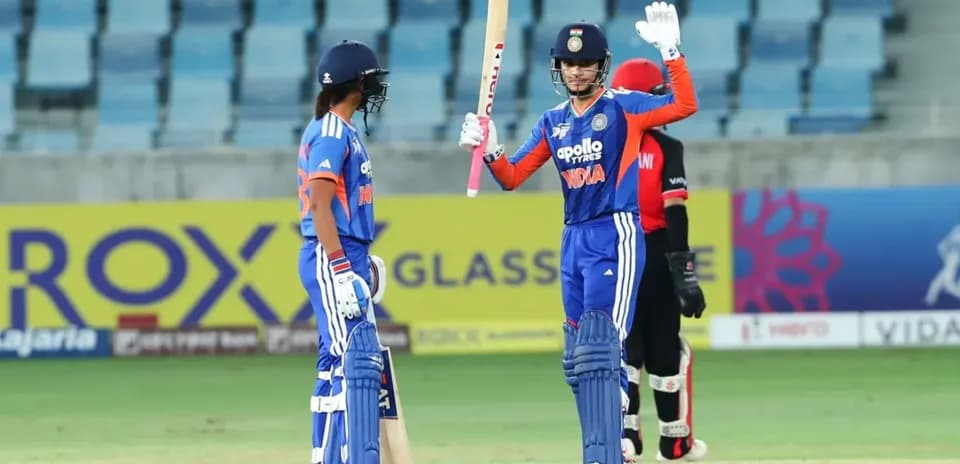 Batsman celebrating a boundary during cricket match