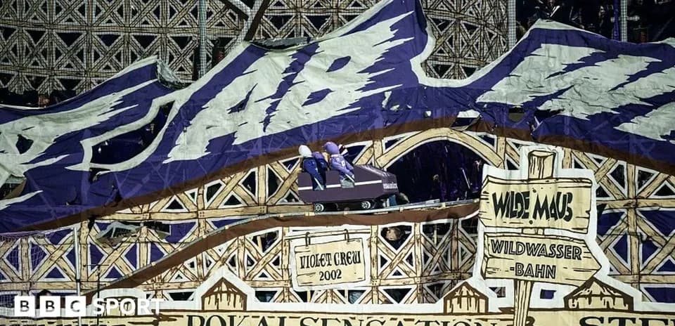 Large banner displayed at football match with roller coaster theme