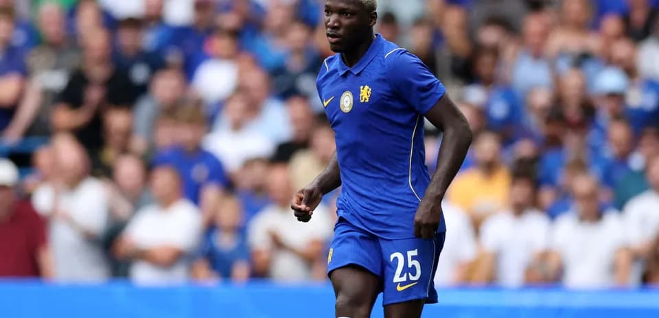 Player wearing Chelsea kit during match action