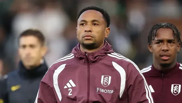 Fulham players preparing for match in team jackets