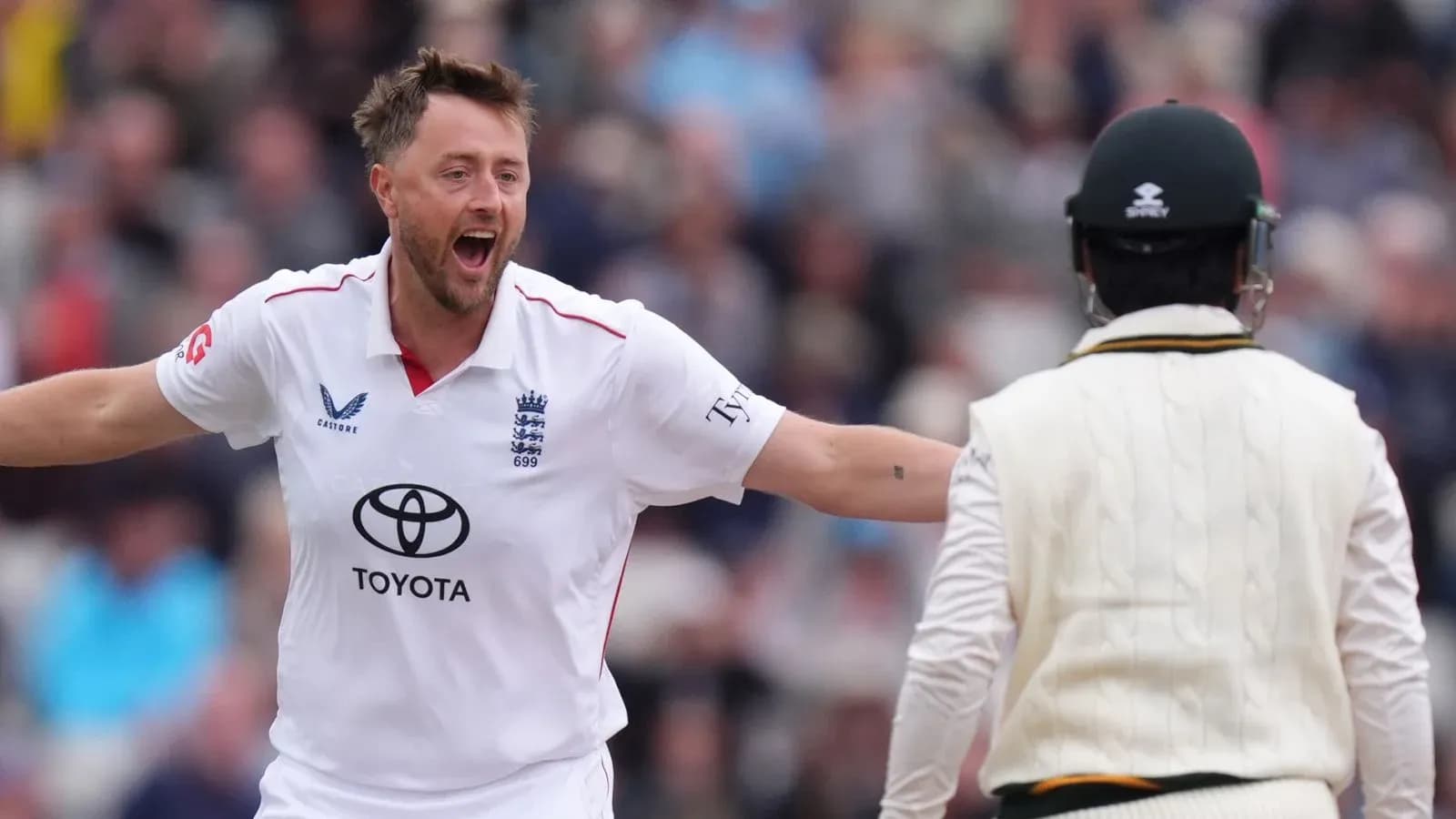 Bowler celebrating wicket against opposing batsman