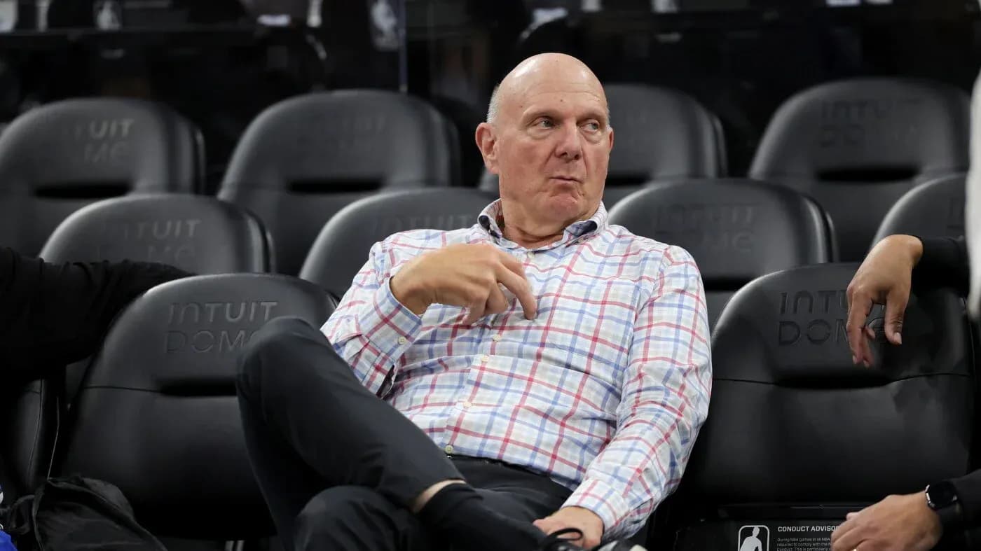 Person sitting on bench at basketball arena