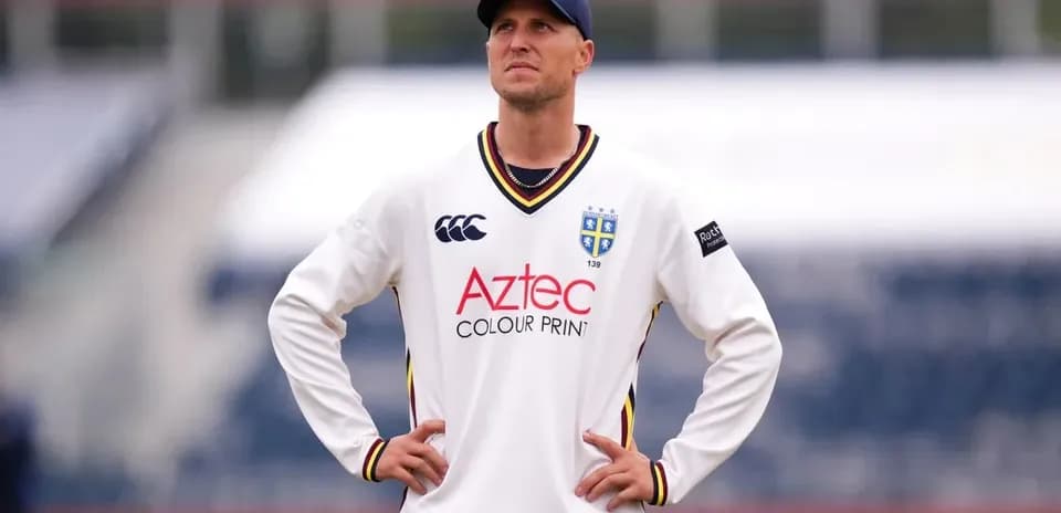 Cricketer wearing team jersey on field