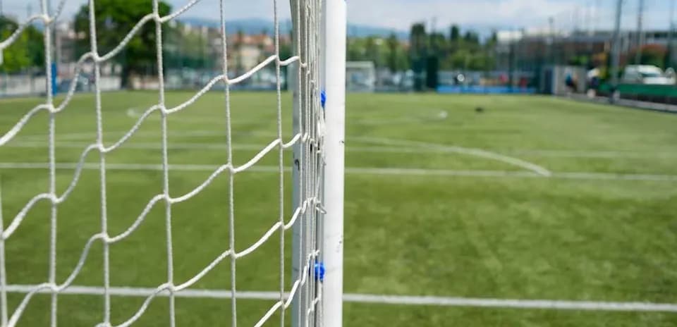 Soccer goal with net on grassy field
