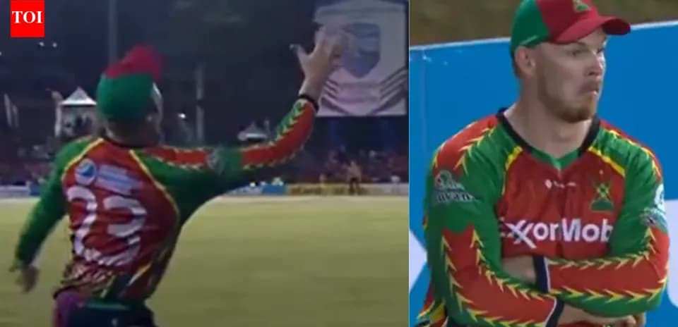 Player catching the ball during cricket match