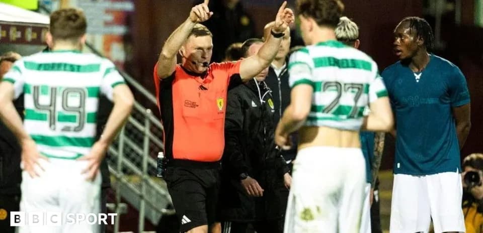 Referee issuing instructions to players on field