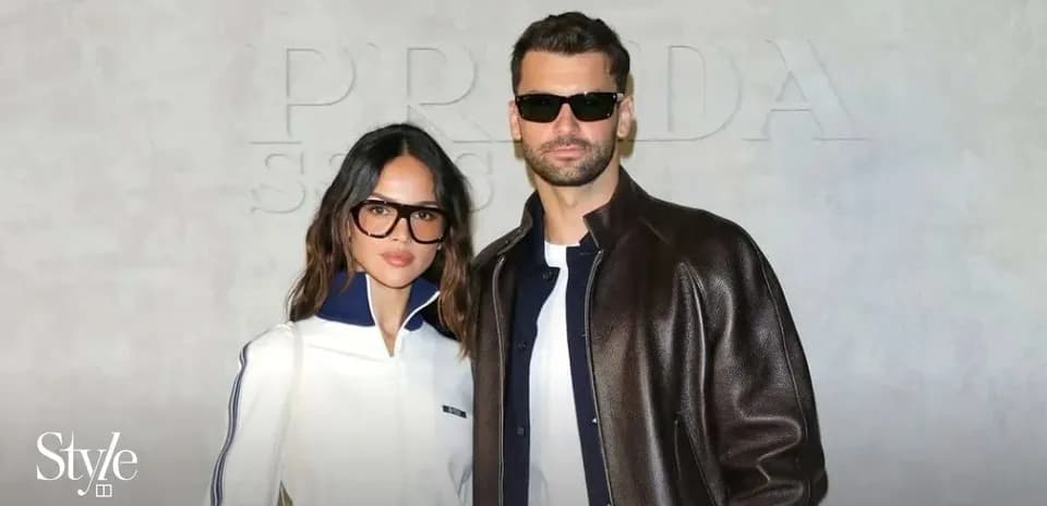 Couple posing together at a fashion event