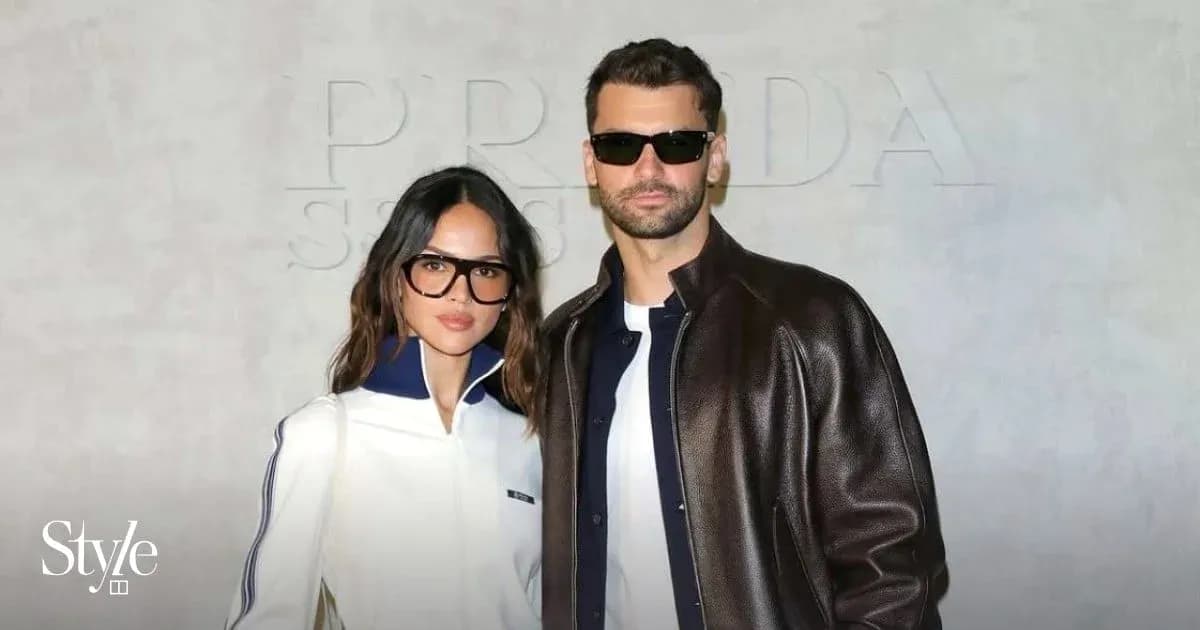 Couple posing together at a fashion event