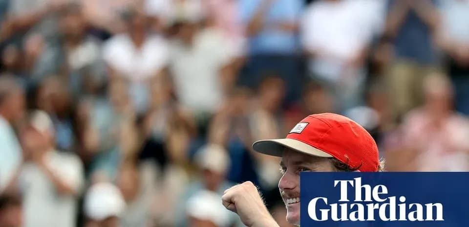 Player celebrating victory in front of cheering crowd