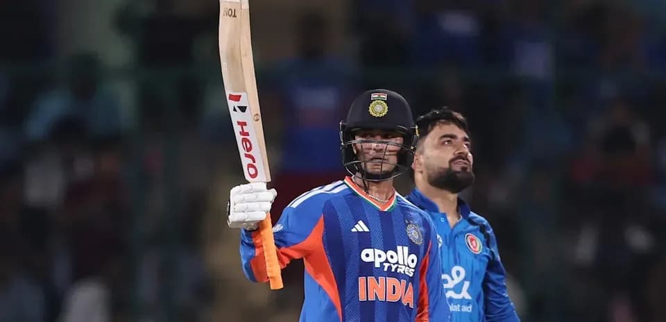Batsman celebrating a milestone in cricket match