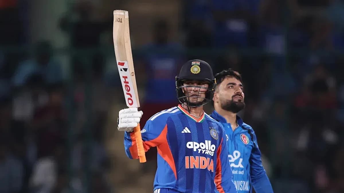 Batsman celebrating a milestone in cricket match