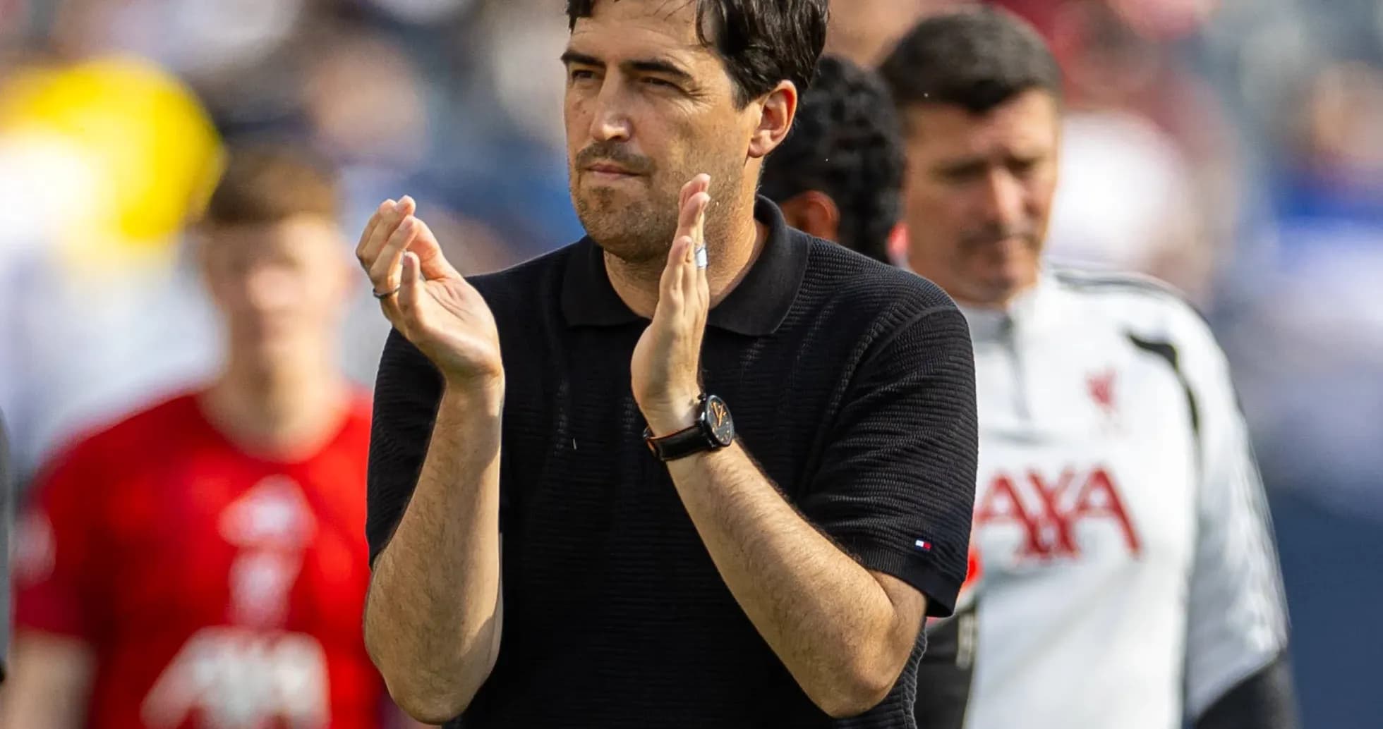 Coach applauding during a match on the field