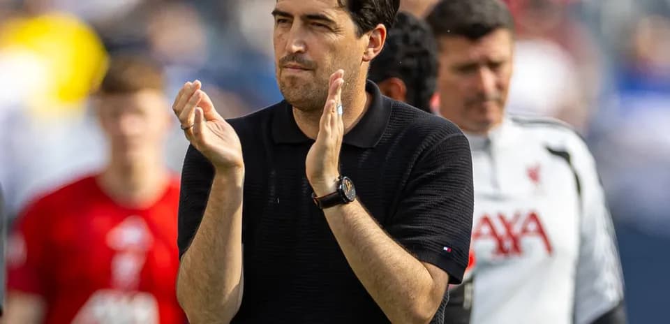 Coach applauding during a match on the field