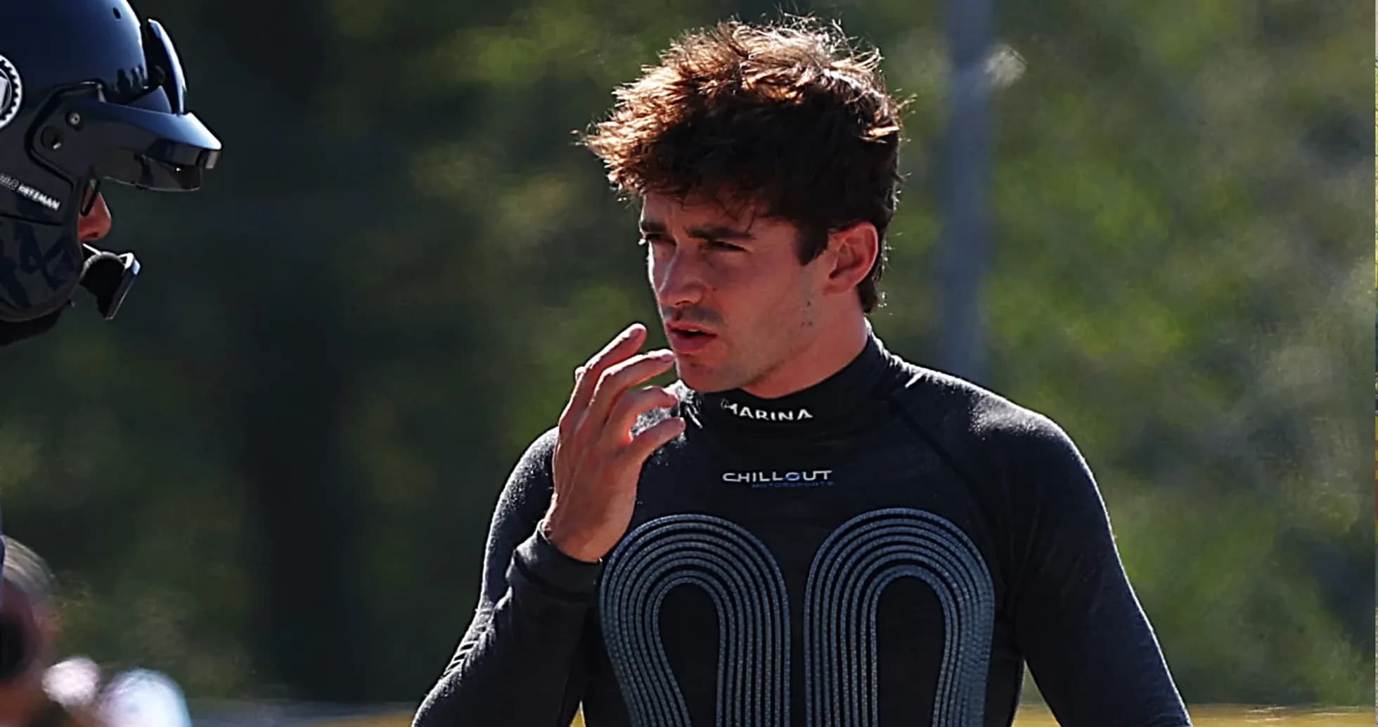 Driver discussing strategy during racing practice session