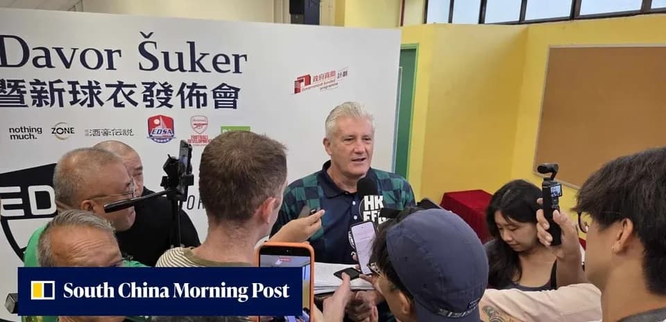 Davor Šuker speaking at a press event surrounded by media